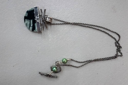 Silver/ Black necklace; J. Garibaldi